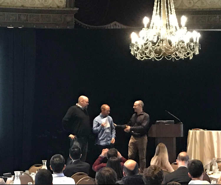 George Tzimpragos and Tim Sherwood accepting the Best Paper Award at ASPLOS 2019 (presented by program co-chair Emmett Witchel)